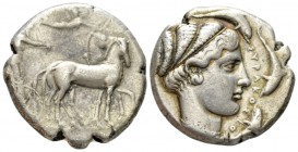 Sicily, Syracuse Tetradrachm circa 430-420, AR 25.5mm., 17.31g. Charioteer, wearing long chiton and holding the reins in both hands, driving slow quad...