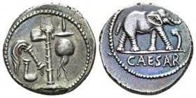 Iulius Caesar. Denarius mint moving with Caesar 49-48, AR 18mm., 3.72g. Pontifical emblems: culullus, aspergillum, axe and apex. Rev. Elephant r., tra...