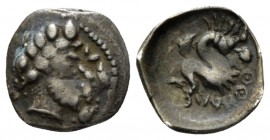 Campania, Allifae Obol circa 310-300, AR 11.5mm., 0.67g. Laureate and bearded head of Glaucus (?) r.; in r. field, dolphin. Rev. Skylla swimming l.; b...