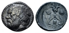 Sicily, Catana Litra circa 420-410, AR 12mm., 0.83g. Ivy-wreathed head of Silenus l. Rev. Winged thunderbolt between two round shields. SNG ANS 1266. ...