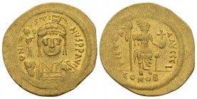 Justin II, 15 November 565 – 5 October 578 Solidus Constantinople 565-578, AV 22mm., 4.41g. Helmeted, pearl-diademed and cuirassed bust facing, holdin...
