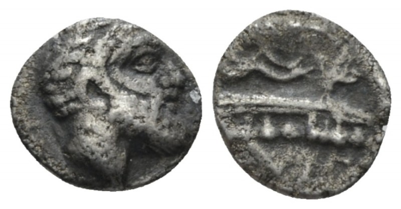 Phoenicia, Aradus Obol circa 400-350, AR 11mm., 0.67g. Laureate head of marine d...