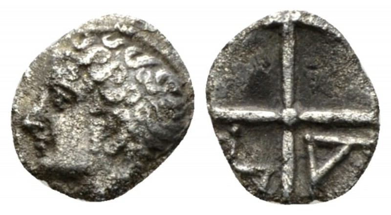 Gallia, Massalia Obol IV Cent BC, AR 9.5mm., 0.43g. Male head l. Rev. Four spoke...