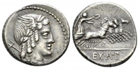 L. Iulius Bursio. Denarius 85, AR 18.5mm., 4.05g. Male head r., with the attributes of Apollo, Mercury and Neptune; behind, wheel. Rev. Victory in qua...