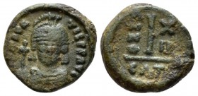 Maurice Tiberius, 582-602 Decanummo Catania 593-594 (year 12), Æ 15mm., 2.88g. Helmeted and cuirassed facing bust, holding globus cruciger. Rev. Large...