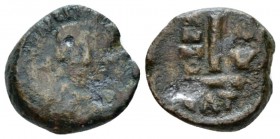 Maurice Tiberius, 582-602. Decanummo Catania 596-597 (year 15), Æ 14mm., 2.80g. Hwlmeted and cuirassed facing bust, holding globus cruciger. Rev Large...