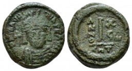Maurice Tiberius, 582-602 Decanummo Catania 600-601 (year 19), Æ 15mm., 3.85g. Helmeted and cuirassed facing bust, holding globus cruciger. Rev Large ...