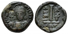 Maurice Tiberius, 582-602 Decanummo Catania 602 (year 21), Æ 14.5mm., 3.47g. Helmetd and cuirassed facing bust, holding globus cruciger. Rev Large I; ...