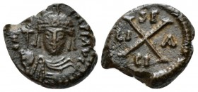 Maurice Tiberius, 582-602. Decanummo Siracusa 588-602, Æ 15mm., 3.00g. Helmeted, draped and cuirassed bust facing, holding globus cruciger. Rev Large ...