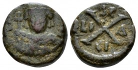 Maurice Tiberius, 582-602 Decanummo Siracusa circa 588-602, Æ 14.5mm., 3.26g. Helmeted, draped and cuirassed bust facing, holding long cross. Rev Larg...