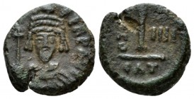 Phocas, 602-610 Decnummo Catania 605-606 (year 4), Æ 14.5mm., 3.32g. Crowned, draped and cuirassed bust facing, holding globus cruciger in r. hand. Re...