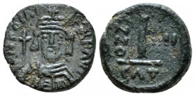Phocas, 602-610 Decanummo Catania 605-606 (year 4), Æ 15.5mm., 3.16g. Crowned, draped and cuirassed bust facing, holding globus cruciger in r. hand. R...