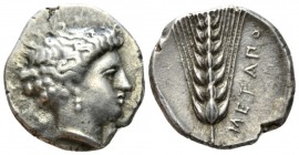 Lucania, Metapontum Nomos circa 340-330, AR 21mm., 7.79g. Head of Demeter r., her hair lightly bound up and wearing earring and necklace. Rev. Ear of ...
