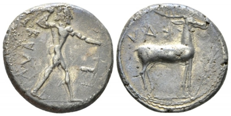 Bruttium, Caulonia Nomos circa 455-450, AR 21mm., 8.13g. Apollo, naked, advancin...