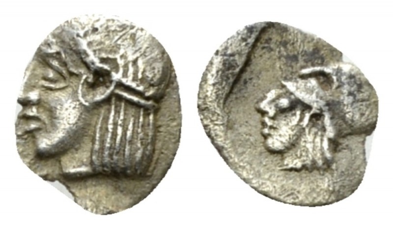 Ionia, Uncertain mint Uncertain mint circa 450-400, AR 7mm., 0.15g. Head of Apol...