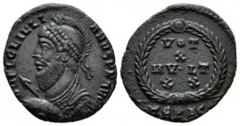 Julian II, 360-363 Follis Heraclea circa 360-363, Æ 21mm., 2.41g. Helmeted and cuirassed bust l., holding spear and shield. Rev. VOT X MVLT XX, legend...