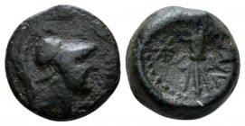 Bruttium, Locri Bronze circa 320-275, Æ 12.5mm., 1.93g. Head of Athena r., wearing Corinthian helmet. Rev. ΛOKPΩN Winged thunderbolt; in l. field, sta...