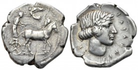 Sicily, Catana Tetradrachm circa 430, AR 34.5mm., 16.83g. Slow quadriga driven r. by charioteer, holding reins and kentron; in field above, Nike flyin...