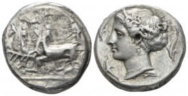 Sicily, Syracuse Tetradrachm 405-399 BC, AR 25mm., 16.83g. Charioteer driving fast quadriga l.; above, flying Nike crowing him and in exergue, ear of ...