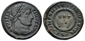 Constantine I, 307-337 Follis Aquileia circa 322, Æ 17mm., 3.17g. . Laureate bust r. Rev. Laurel wreath enclosing VOT XX; laurel branches to l. and r....