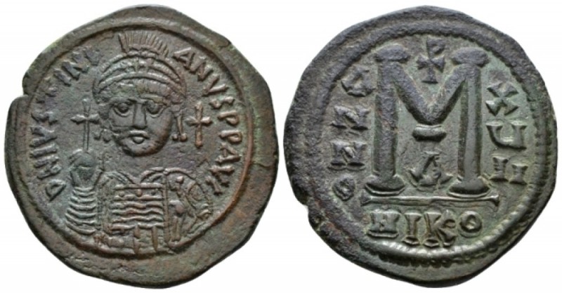 Justinian I, 527-565. Follis Nicomedia circa 543-544, Æ 36mm., 19.89g. Helmeted ...