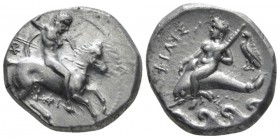 Calabria, Tarentum Nomos circa 332-302, AR 20mm., 7.72g. Armed horseman r. spearing down. Rev. Dolphin rider l., holding distaff; behind, eagle and be...