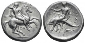 Calabria, Tarentum Nomos circa 315-300, AR 21mm., 7.80g. Armed horseman galloping r., spearing downwards. Rev. Dolphin rider l., holding trident and c...
