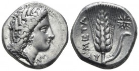Lucania, Metapontum Nomos circa 330-290, AR 21mm., 7.86g. Head of Demeter r., wearing barley wreath. Rev. Ear of barley with leaf to r., on which, sta...