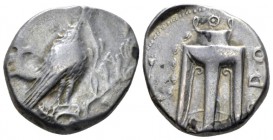 Bruttium, Croton Nomos circa 430-420, AR 21mm., 7.65g. Eagle standing r. on Ionic capital; branch to r. Rev. Filleted tripod, legs terminating in lion...