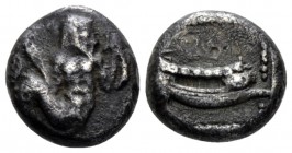 Phoenicia, Uncertain king Arados Tetrobol circa 430-410, AR 13mm., 3.28g. Ba'al-Arwad swimming r., holding fish in each hand. Rev. Galley r. in dotted...