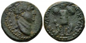 Judaea, Caesarea Maritima Titus Caesar, 69-79 Bronze circa 69-79, Æ 23.4mm., 12.48g. Laureate head r. Rev. Trophy; at feet l., bound captive and to r....