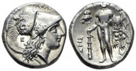 Lucania, Heraclea Nomos circa 281-278, AR 21mm., 7.83g. Helmeted head of Athena r., bowl decorated with Scylla hurling stone; behind neck-guard, E. Re...