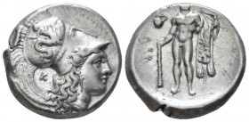 Lucania, Heraklea Nomos circa 330-320, AR 21mm., 7.76g. Head of Athena r., wearing helmet decorated with Scylla hurling stone; behind neck, K. Rev. He...