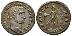 Maximinus II Caesar, 305-308. Follis Alexandria late 308/310, Æ 22.40mm., 6.80g. Laureate head r. Rev. Genius standing l., holdig patera and cornucopi...