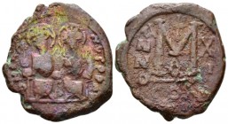 Justin II, 565-578. Follis Cyzicus circa 573-574, Æ 3mm., 12.16g. Justin and Sophia seated facing on double throne, with feet on footstool, holding gl...