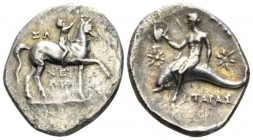 Calabria, Tarentum Nomos circa 280-272, AR 23mm., 5.80g. Nude youth crowning horse he rides r. Rev. Oecist holding helmet, riding dolphin l.; in field...