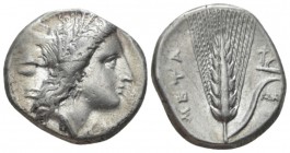 Lucania, Metapontum Nomos circa 330-290 BC, AR 20mm., 7.71g. Head of Demeter r., wearing grain wreath and triple-pendant earring; below chin, ΔAI. Rev...