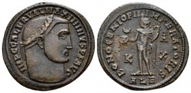 Maximinus II, 309-313 Follis Alexandria circa, Æ 25.6mm., 6.43g. Laureate head r. Rev. Genius standing l., holding cornucopia and patera; (crescent)-B...