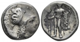 Lucania, Heraclea Nomos circa 340-330, AR 20mm., 7.87g. Head of Athena r., wearing crested Corinthian helmet, decorated with a Skylla hurling a stone....