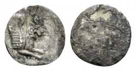 Judaea, Hezekiah Half Gerah or Hemiobo Persian or Macedonian Period, circa 350-332 or 332-302/1 BC, AR 6mm., 0.13g. Head facing (off flan or deteriora...