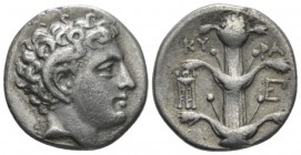 Cyrenaica, Cyrene Didrachm circa 305-300, AR 22mm., 7.40g. Head of Apollo Carneius r. Rev. Silphium plant; tripod and monogram flanking. SNG Copenhage...