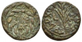 Judaea, Tiberias Herod III Antipas, 4 BC-39 AD Half unit circa 33-34, Æ 17mm., 4.31g. Mint in two lines within wreath. Rev. Palm frond; in field, L-ΛZ...