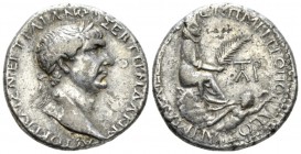 Trajan, 98-117 Tetradrachm circa 100, AR 25.5mm., 14.50g. Laureate head r. Rev. Tyche seated r. on rock outcropping, holding palm frond; below, river-...