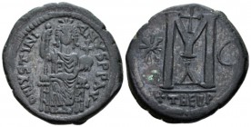 Justinian I, 527-565. Follis Theoupolis (Antiochia) circa 527-565, Æ 32mm., 17.46g. Justinian enthroned facing, holding long sceptre with his r. hand ...