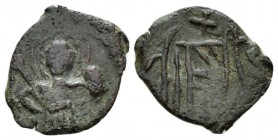 Capua, Fraction of follaro after 1145, Æ 14mm., 1.33g. Nimbate figure of St. Demetrius standing facing, holding sword. Rev. Pseudo-Cufic legend; above...