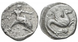Calabria, Tarentum Nomos circa 500-480, AR 20mm., 8.09g. Oecist riding dolphin r. extending l. hand and holding octopus. Rev. Hippocamp standing r.; b...