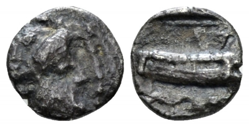 Phoenicia, Aradus Obol circa 400-350, AR 9mm., 0.72g. Laureate head of marine de...