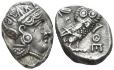 Attica, Athens Tetradrachm late IV early III century BC, AR 19.10mm., 16.54g. Head of Athena r., wearing crested Attic helmet. Rev. Owl, with closed w...