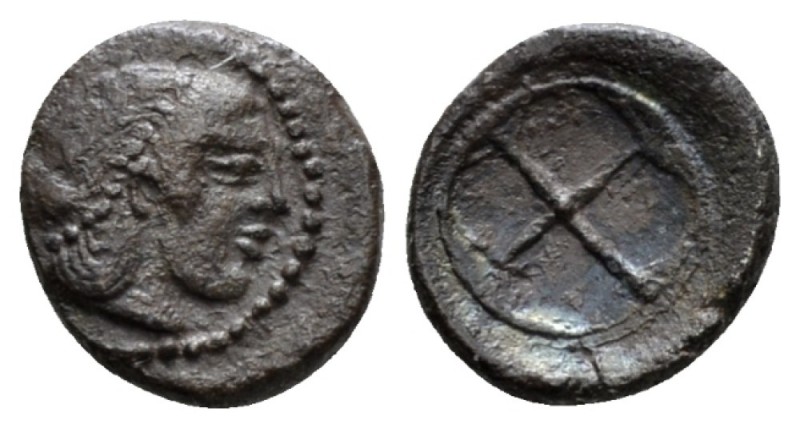 Sicily, Syracuse Obol circa 480-475, AR 8.5mm., 0.67g. Head of nymph r. Rev. Whe...