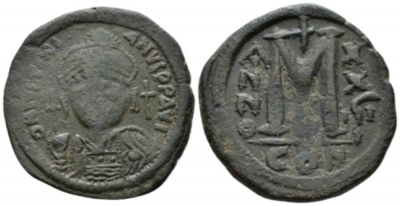 Justinian I, 527-565 Follis Constantinople 544-545, Æ 32mm., 17.29g. Helmeted an...